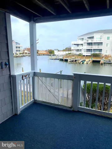 a view of water heater room with wooden floor
