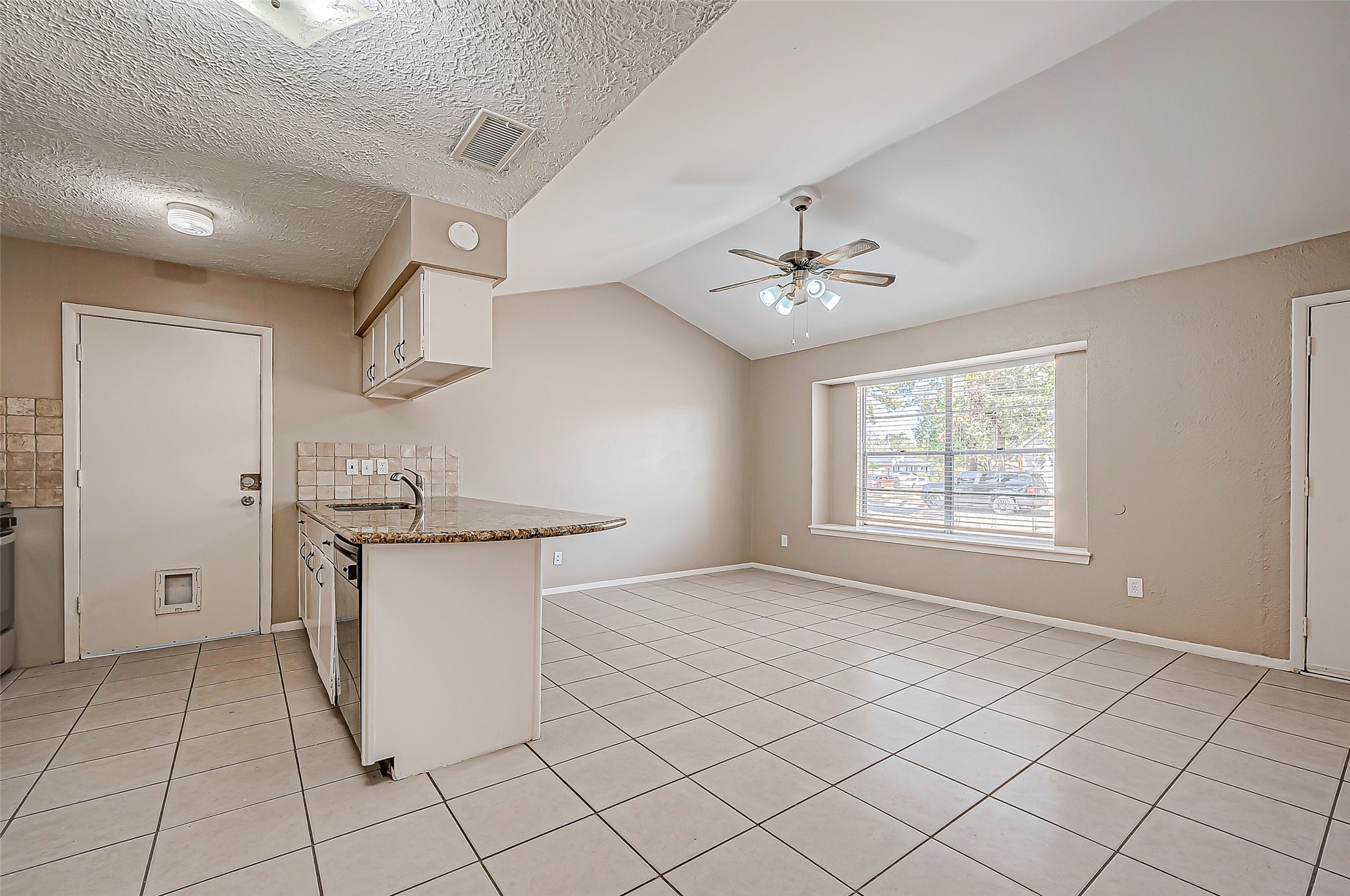 7027 Inkberry Drive Houston, TX 77092 - Photo 11 of 37 a view of a kitchen with cabinet and a stove top oven