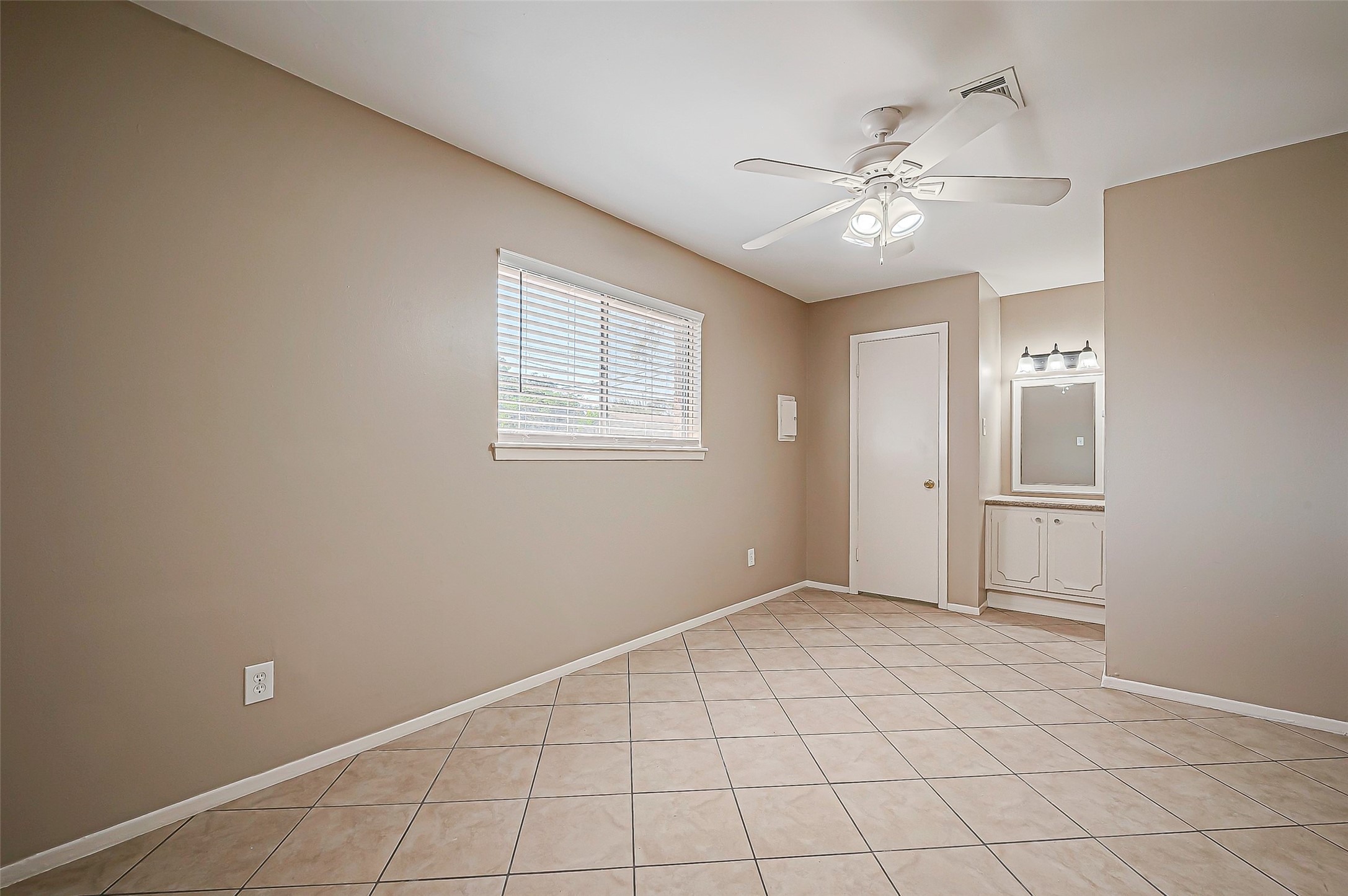 7027 Inkberry Drive Houston, TX 77092 - Photo 24 of 37 a view of an empty room with a window