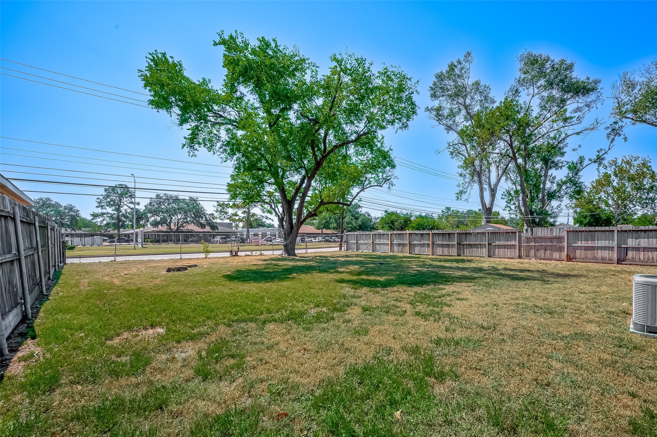7027 Inkberry Drive Houston, TX 77092 - Photo 33 of 37 a view of yard with swimming pool and green space