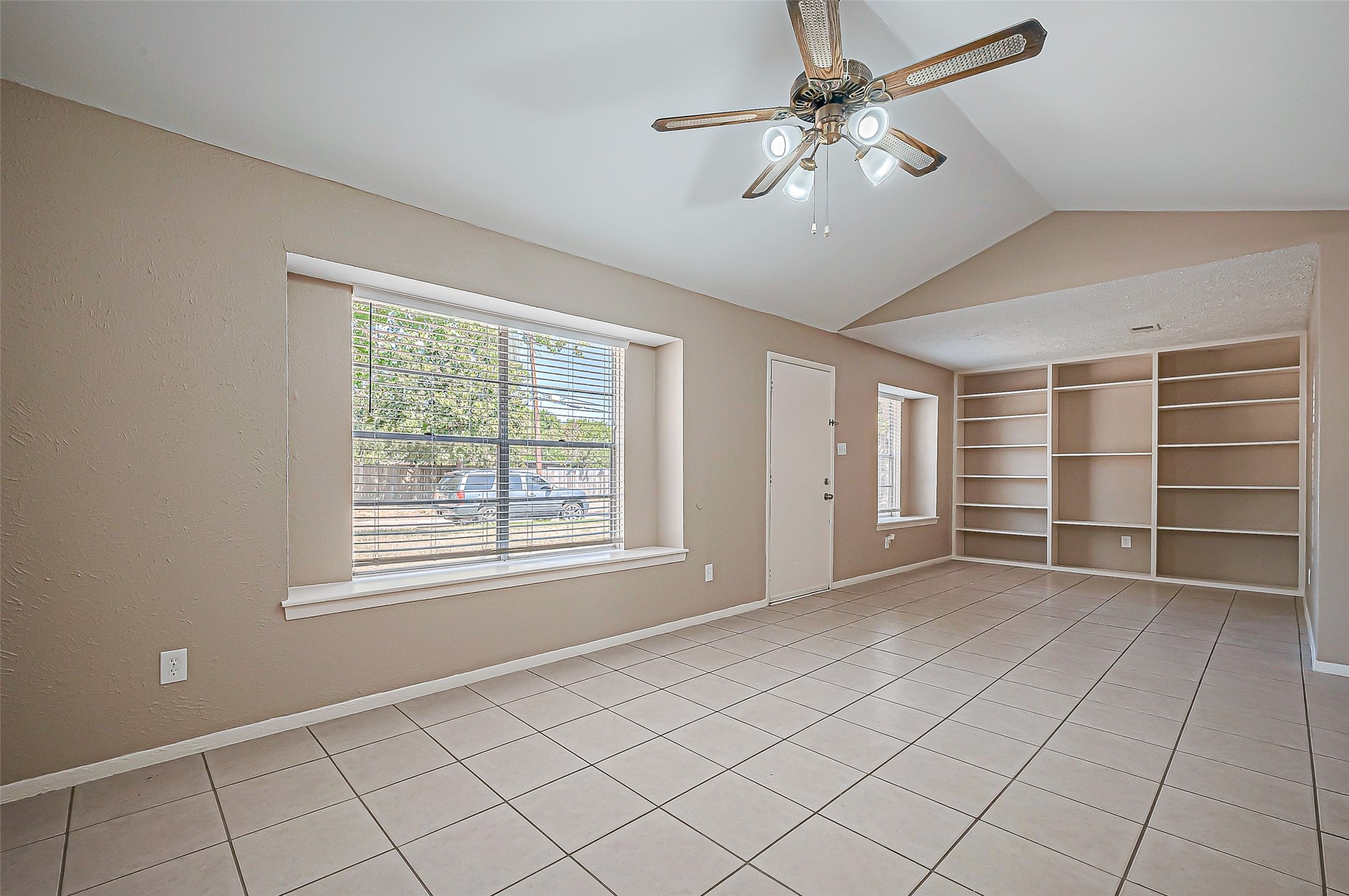 7027 Inkberry Drive Houston, TX 77092 - Photo 9 of 37 a view of an empty room with a window