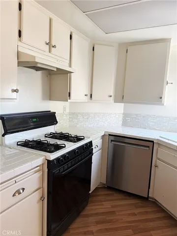 a utility room with sink dryer and washer