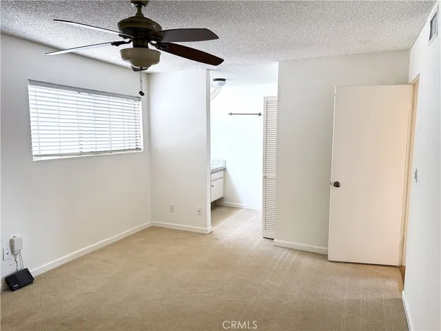 a view of a livingroom with a ceiling fan and a ceiling fan