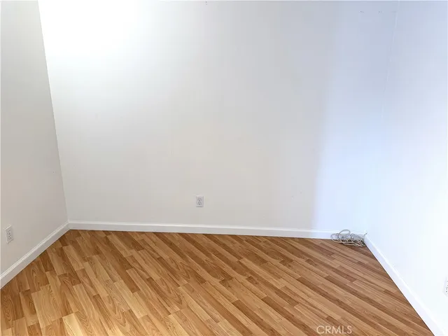 a kitchen with granite countertop wooden cabinets and a stove top oven
