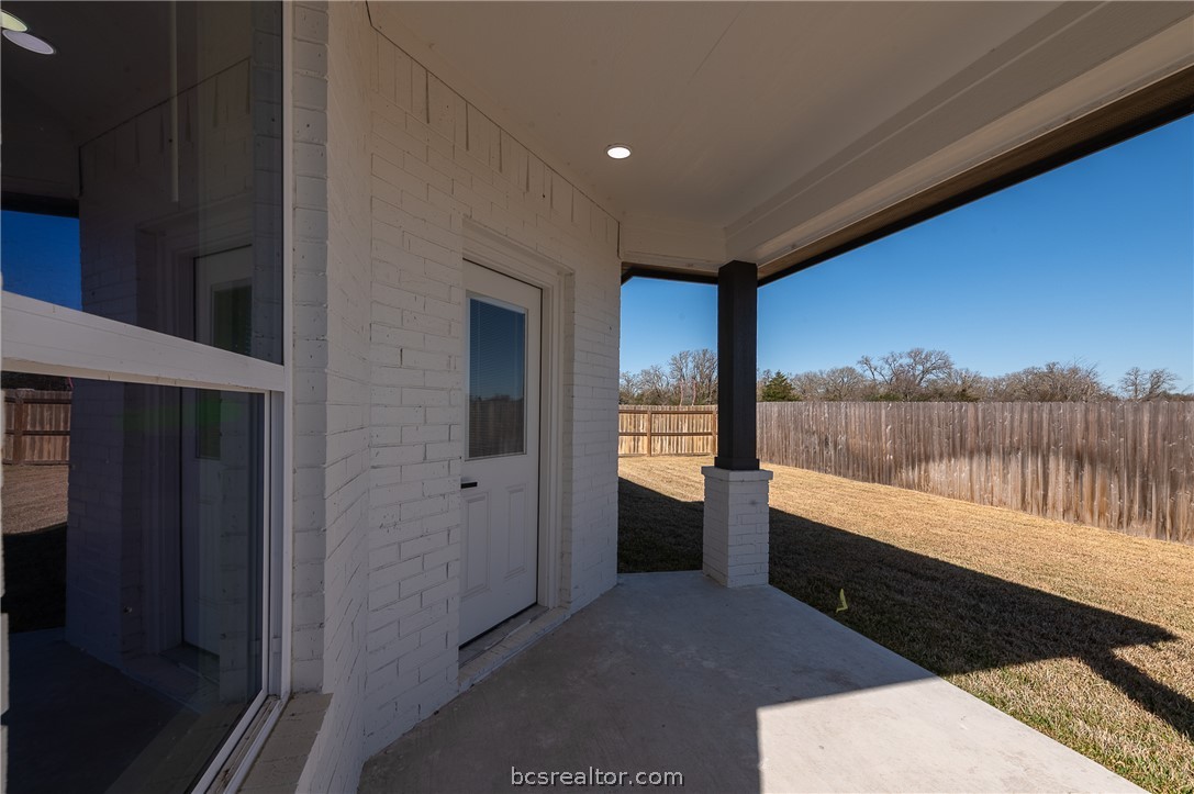 2908 GOLDBERG Drive Bryan, TX 77808 - Photo 40 of 44 Covered back porch off of the living area features covered porch, privacy wood fenced yard plus fully sodded yard and irrigation system.