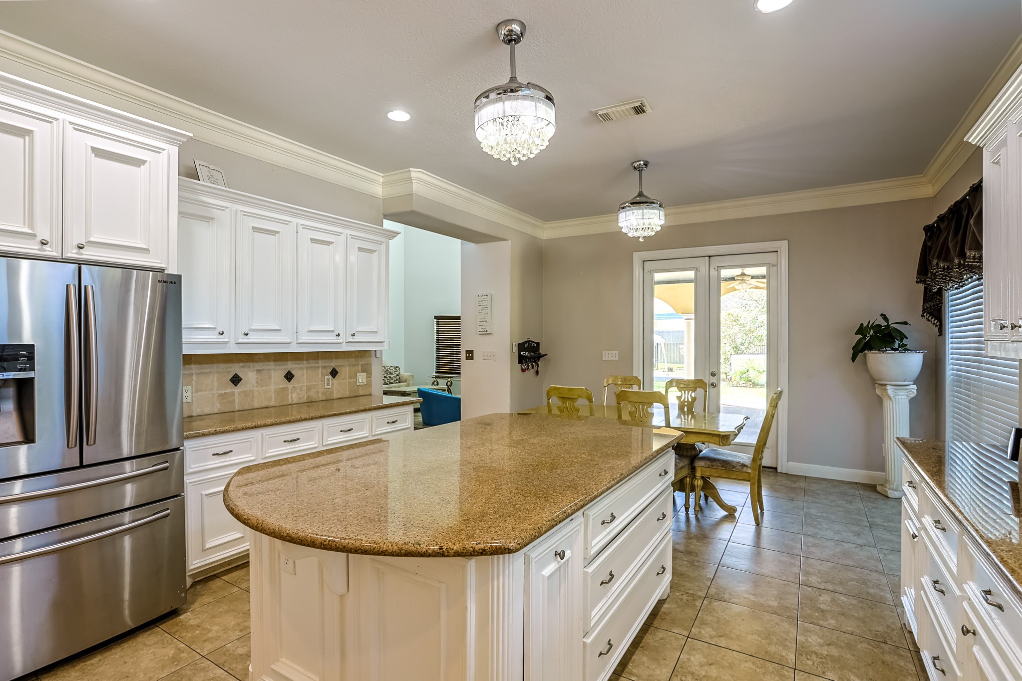 30119 West Geneva Drive Spring, TX 77386 - Photo 13 of 35 Open breakfast area with French doors leading to the backyard — ideal for morning coffee or weekend brunch