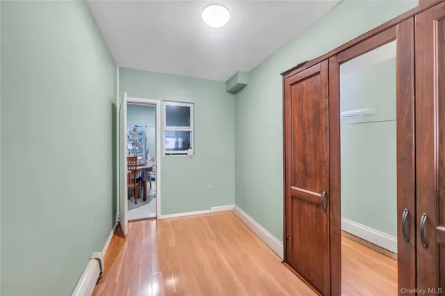 a view of hallway with wooden floor