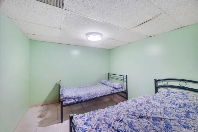 a bedroom with a bed and two lamp