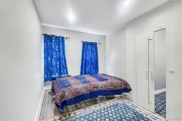 a bedroom with a bed and a table