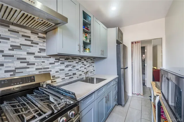 a kitchen with a stove and a refrigerator
