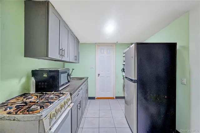 a kitchen with a stove and a refrigerator