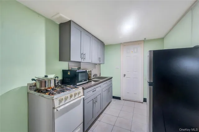 a kitchen with a stove and a refrigerator