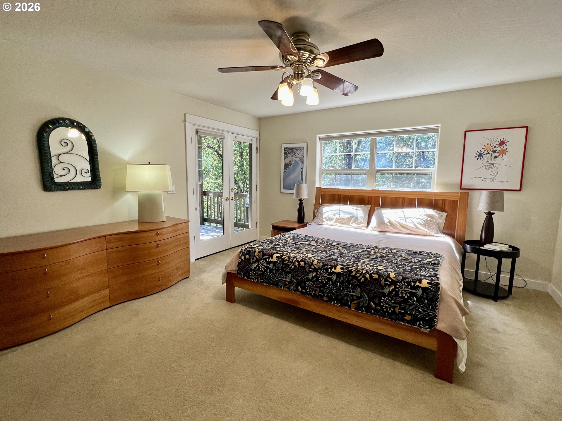 28544 Crow Road Eugene, OR 97402 - Photo 16 of 48 a bedroom with a bed mirror and a window
