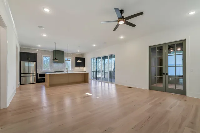 a view of kitchen with wooden floor and a window