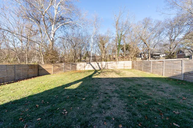 a view of yard with swimming pool