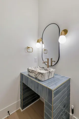a bathroom with a sink and a mirror