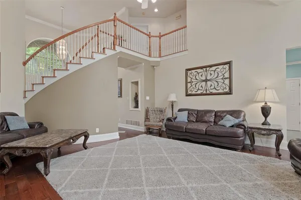 a living room with furniture and a rug