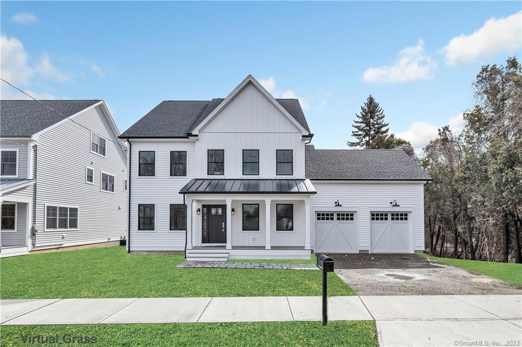 855 Stillson Road Fairfield, CT 06824 - Photo 1 of 1 a front view of a house with a yard