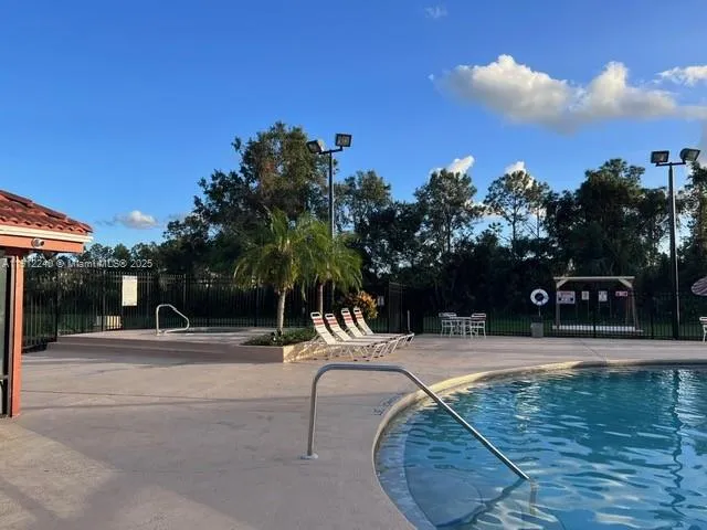 a view of a swimming pool with a patio