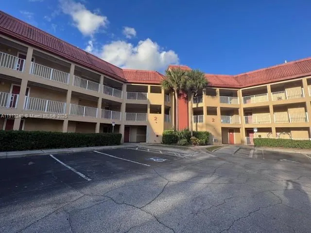 a view of a building with a yard