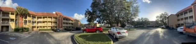 a view of outdoor space with seating area and trees