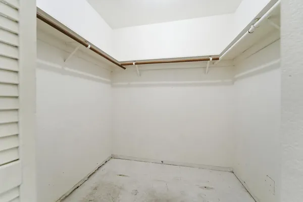 a view of an empty walk in closet