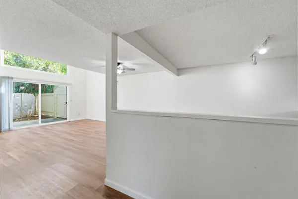 a view of an empty room with a window