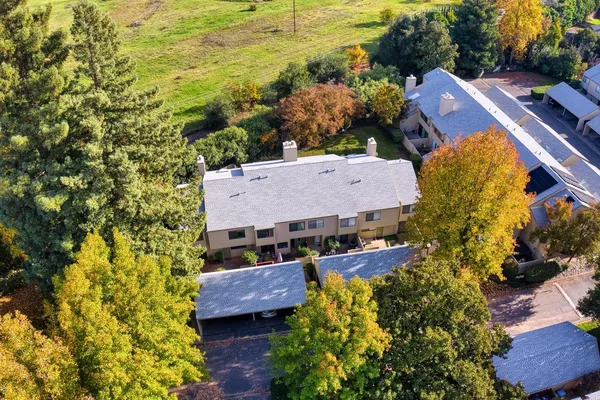 an aerial view of a house with a garden