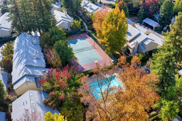 an aerial view of a house with a yard and garden