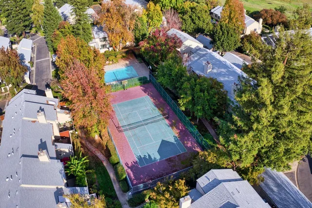 an aerial view of a house with a yard