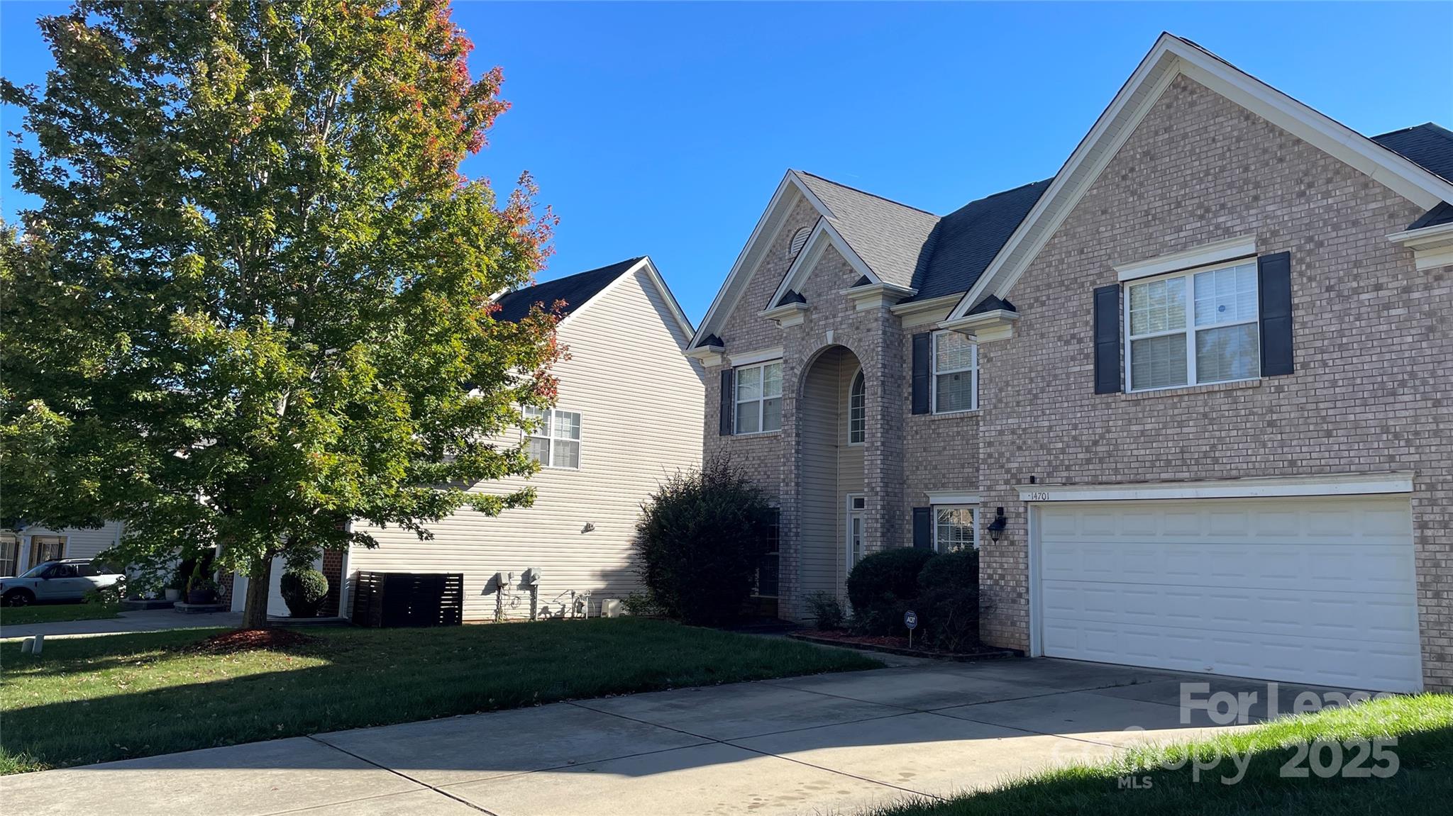 14701 Provence Lane Charlotte, NC 28277 - Photo 2 of 10 a front view of a house with a yard
