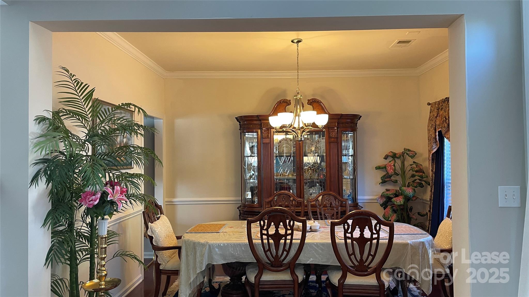 14701 Provence Lane Charlotte, NC 28277 - Photo 3 of 10 a view of a dining room with furniture and chandelier