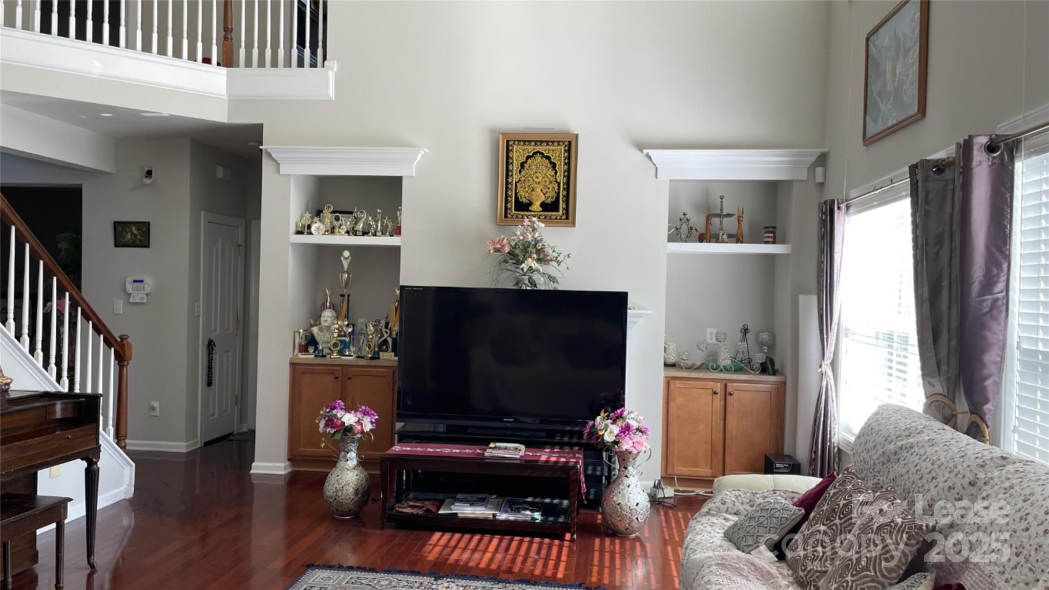 14701 Provence Lane Charlotte, NC 28277 - Photo 5 of 10 a living room with furniture and a flat screen tv