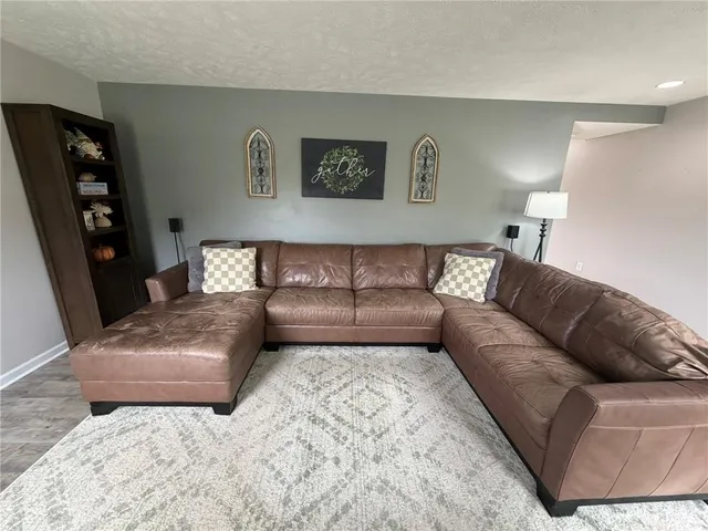 a living room with furniture and a couch