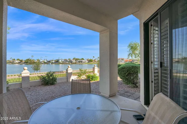 a swimming pool with outdoor seating and yard