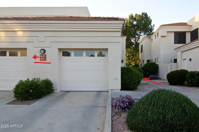 a view of a balcony with potted plants