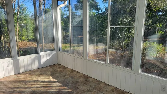 a view of a glass door and the balcony