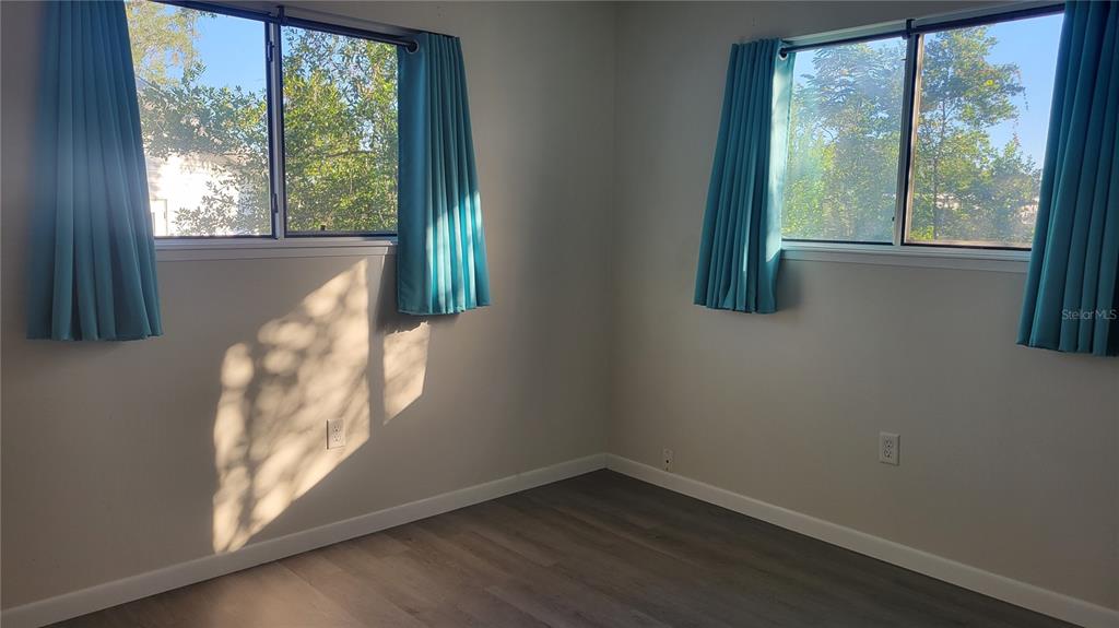 10881 Southwest 75th Avenue Ocala, FL 34476 - Photo 6 of 11 a view of a small space with wooden floor and a window