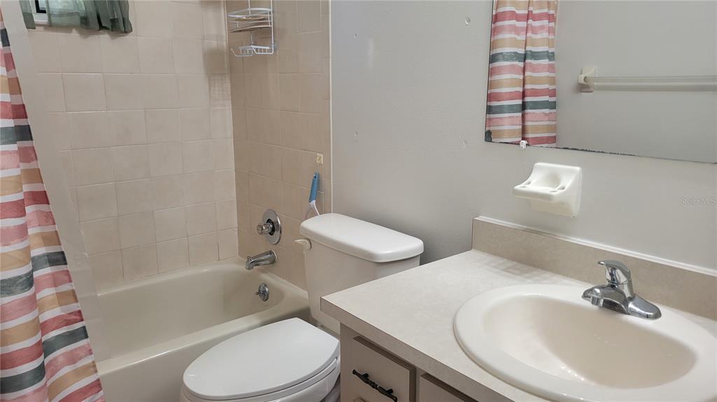 10881 Southwest 75th Avenue Ocala, FL 34476 - Photo 8 of 11 a bathroom with a sink toilet and shower