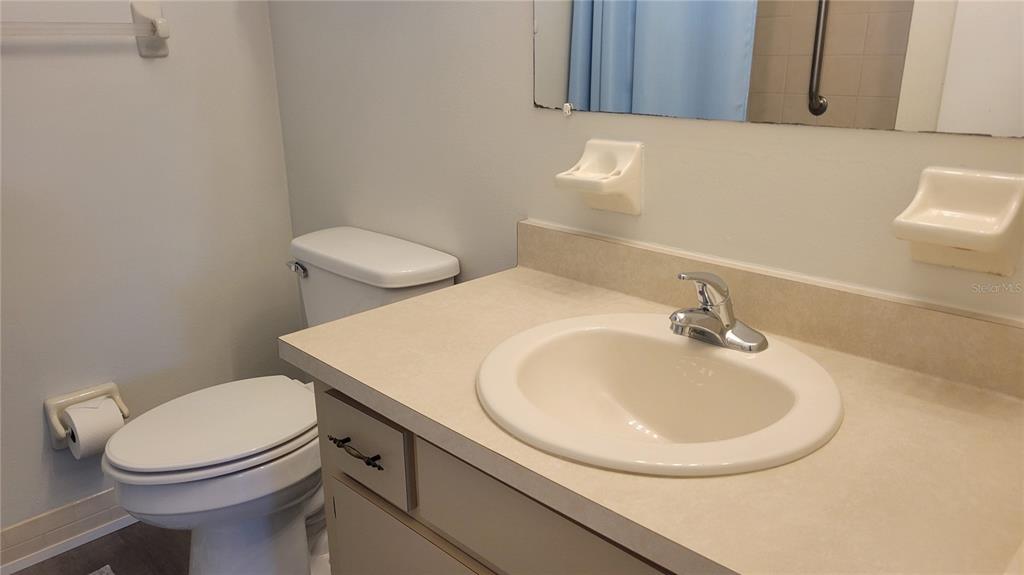 10881 Southwest 75th Avenue Ocala, FL 34476 - Photo 9 of 11 a bathroom with a toilet sink and mirror