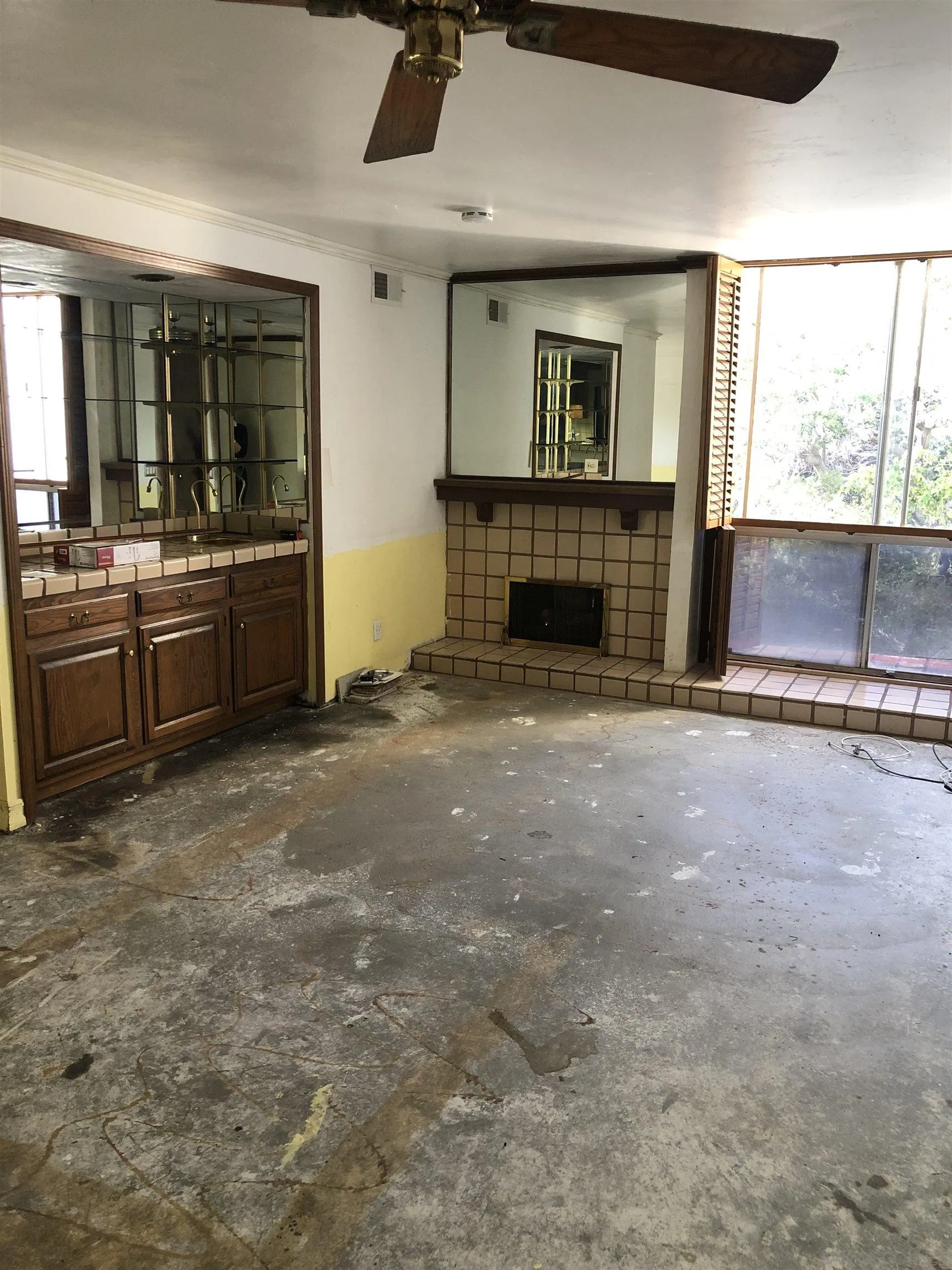 6202 Friars Road, Unit 224 San Diego, CA 92108 - Photo 8 of 13 a view of an empty room with a fireplace and a window