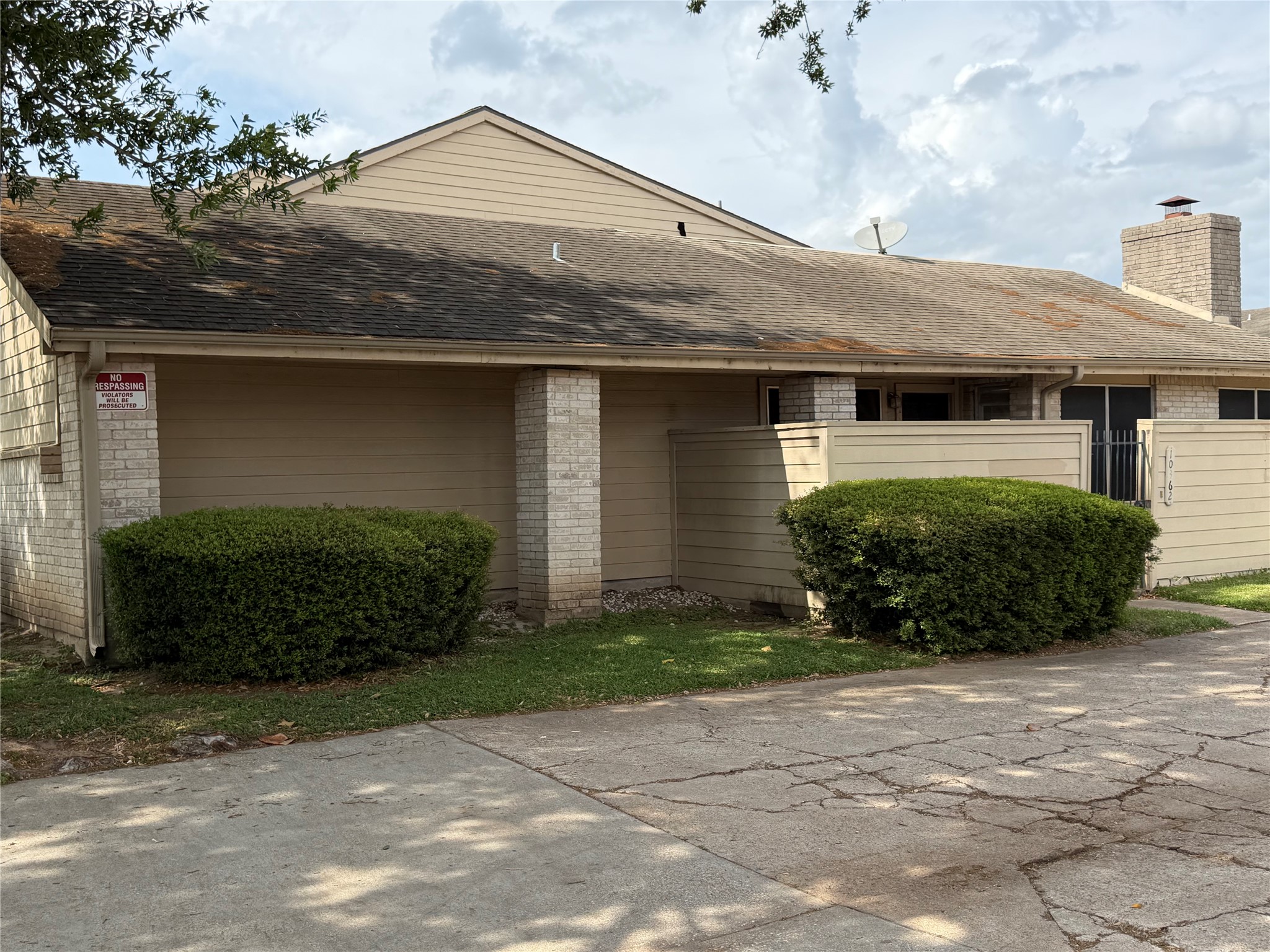10362 Cook Road Houston, TX 77099 - Photo 13 of 16 a front view of a house with a yard