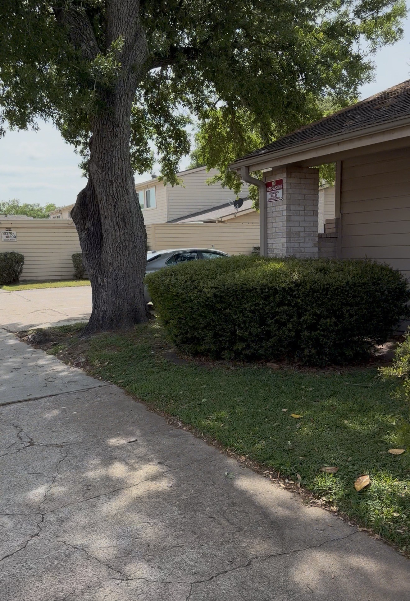10362 Cook Road Houston, TX 77099 - Photo 6 of 16 a front view of a house with a garden