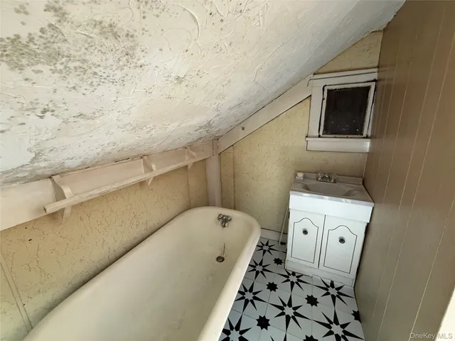 a bathroom with a bathtub and shower