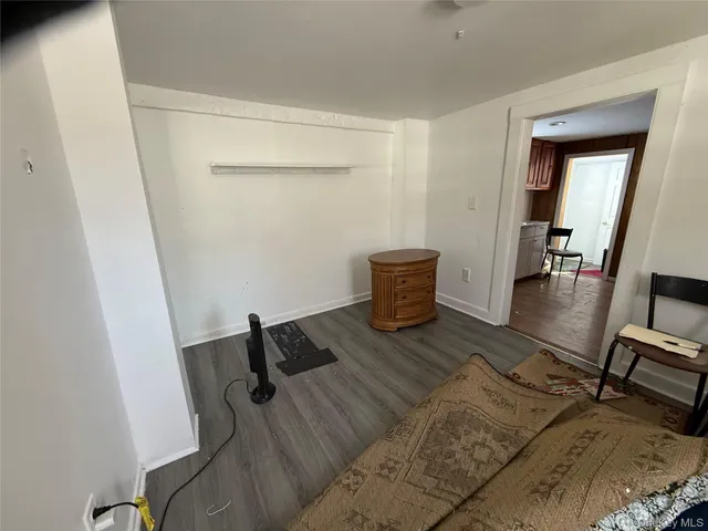 a view of workspace with wooden floor and lounge chair