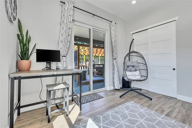 a view of a livingroom with furniture and wooden floor
