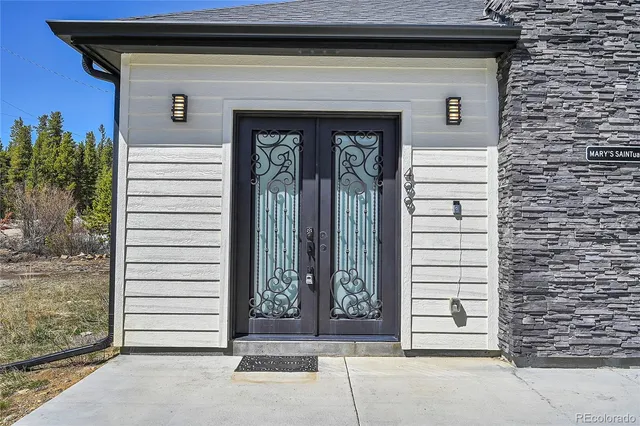 a front view of a house with a white door