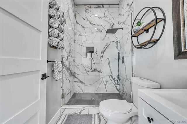 a bathroom with a toilet and a sink