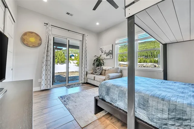 a living room with couch and a large window