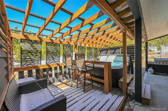 a view of a patio with wooden floor